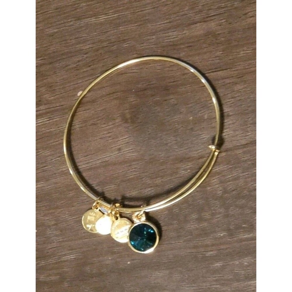 Alex & Ani May Birthstone Expandable Bangle in a shiny gold finish.